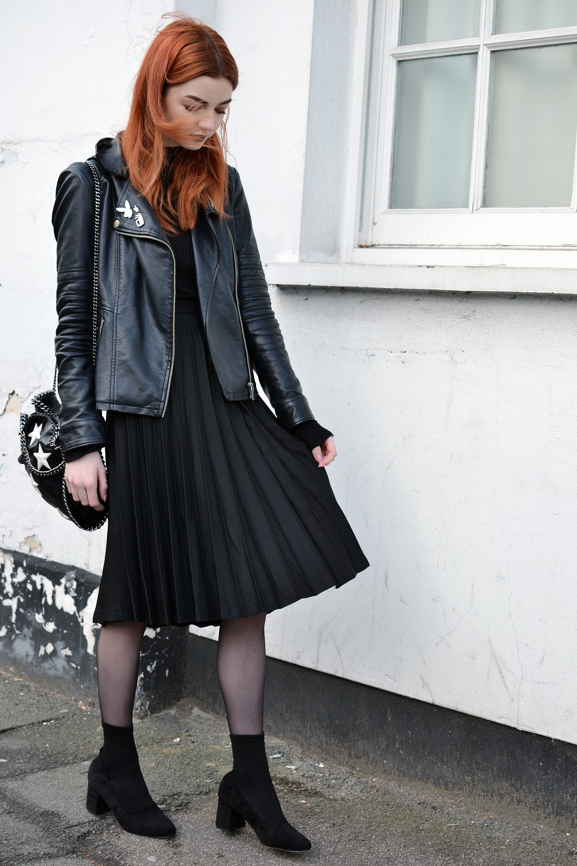 black pleated midi skirt