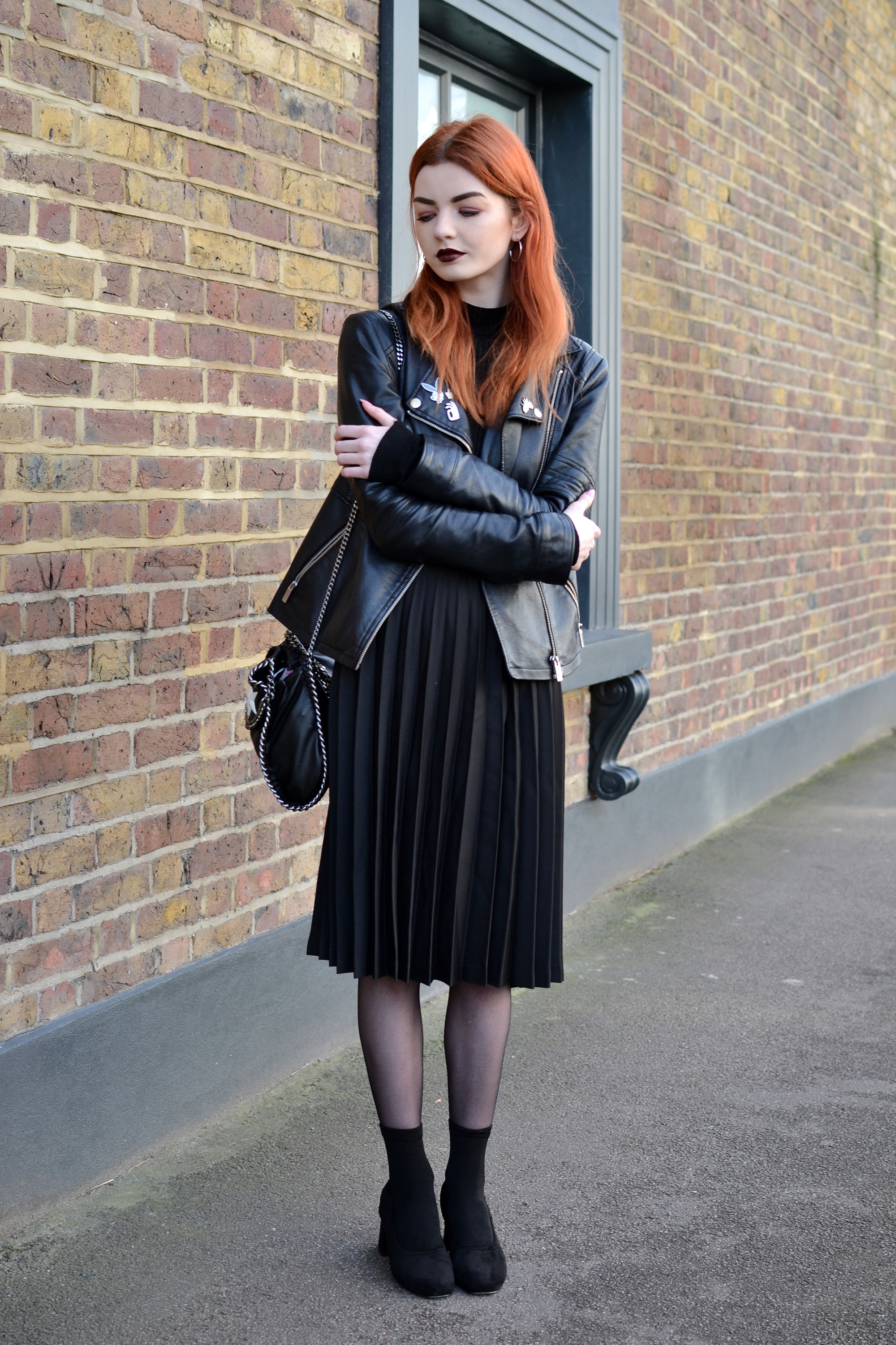 black pleated midi skirt